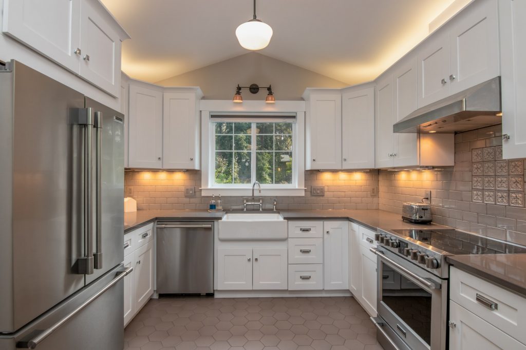 kitchen with stainless steel appliances like toaster, microwave oven and refrigerator